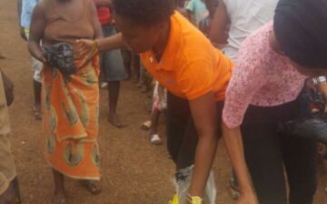 Mrs. Kupee and team distributing food items to villagers around Fandell, rural Montsurrado county