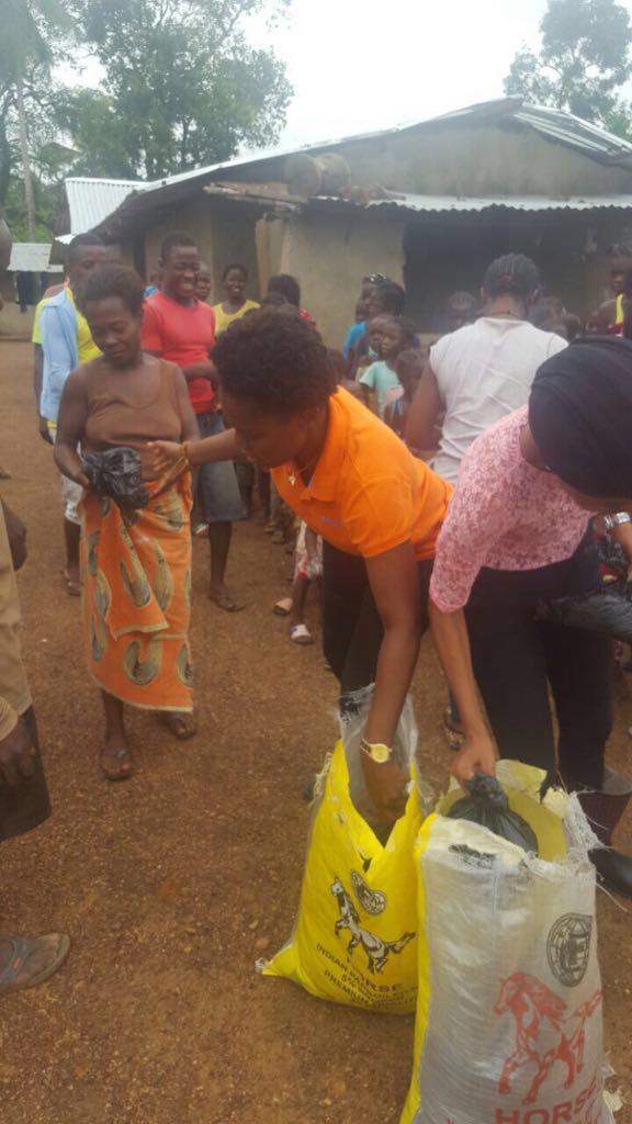 Mrs. Kupee and team distributing food items to villagers around Fandell, rural Montsurrado county